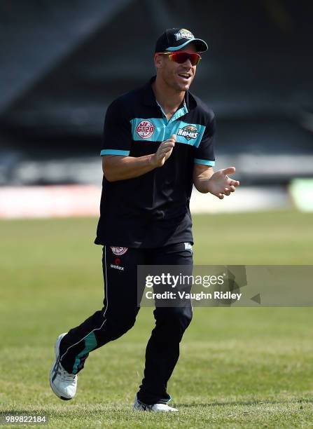 David Warner of Winnipeg Hawks warms up prior to a Global T20 Canada match against Toronto Nationals at Maple Leaf Cricket Club on July 2, 2018 in...