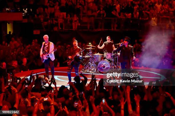 Larry Mullen Jr., The Edge, Bono and Adam Clayton of U2 perform on stage during the "eXPERIENCE & iNNOCENCE" tour at Madison Square Garden on July 1,...