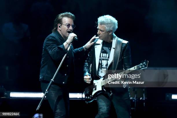 Bono and Adam Clayton of U2 perform on stage during the "eXPERIENCE & iNNOCENCE" tour at Madison Square Garden on July 1, 2018 in New York City.