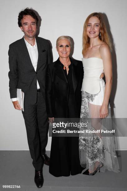 Stylist Maria Grazia Chiuri standing between General manager of Berluti Antoine Arnault and Natalia Vodianova pose after the Christian Dior Haute...