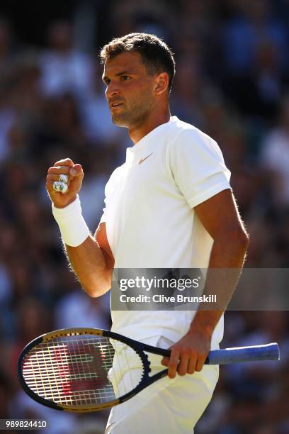 Grigor Dimitrov of Bulgaria celebrates a point against Stanislas Wawrinka of Switzerland during their Men's Singles first round match on day one of...