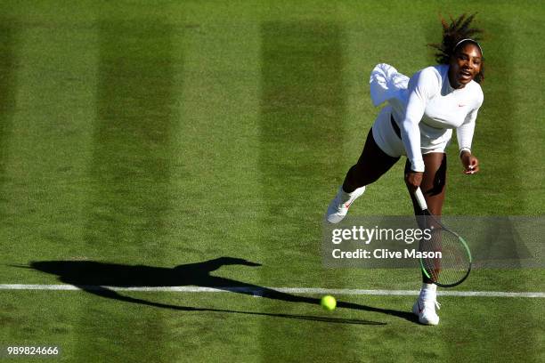 Serena Williams of The United States serves against Arantxa Rus of The Netherlands during their Ladies' Singles first round match on day one of the...