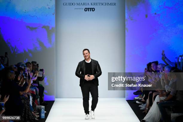 Designer Guido Maria Kretschmer acknowledges the applause of the audience after his show during the Berlin Fashion Week Spring/Summer 2019 at ewerk...