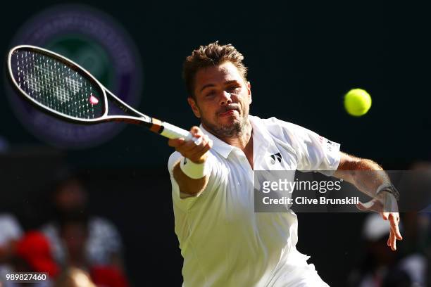 Stanislas Wawrinka of Switzerland returns against Grigor Dimitrov of Bulgaria during their Men's Singles first round match on day one of the...