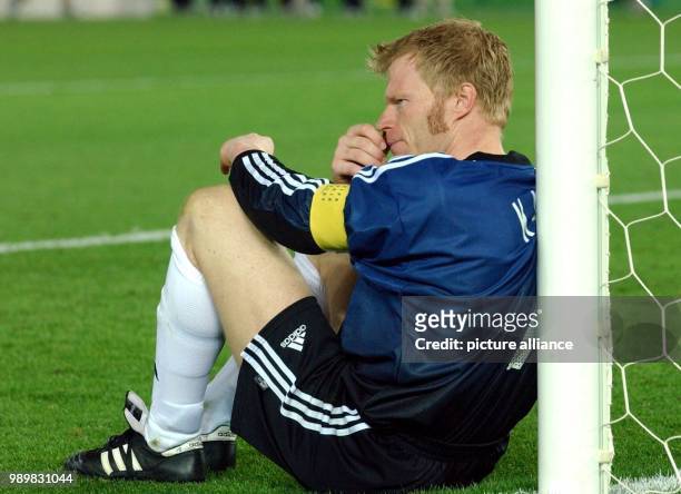 German goalkeeper Oliver Kahn sits defeated in his goal after the FIFA World Cup final opposing Germany and Brazil in Yokohama, Japan, 30 June 2002....