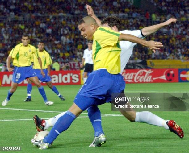 Brazilian star forward Ronaldo gets the best of German defender Thomas Linke. The Brazilian national team wins the final of the 17th World Cup...