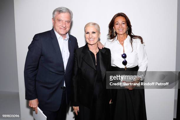 Stylist Maria Grazia Chiuri standing between Sidney Toledano and his wife Katia pose after the Christian Dior Haute Couture Fall Winter 2018/2019...