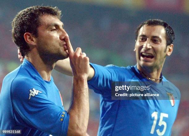 Italian forward Christian Vieri celebrates his goal against South Korea with team-mate Mark Iuliano which gives the Italians a 1-0 lead over the...