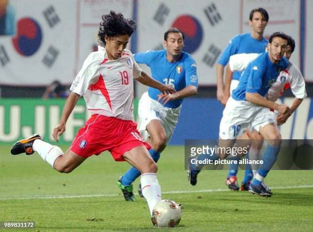 South Korean midfielder Ahn Jung-Hwan is about to kick the ball in full run during the 2002 Soccer World Cup second round game South Korea against...
