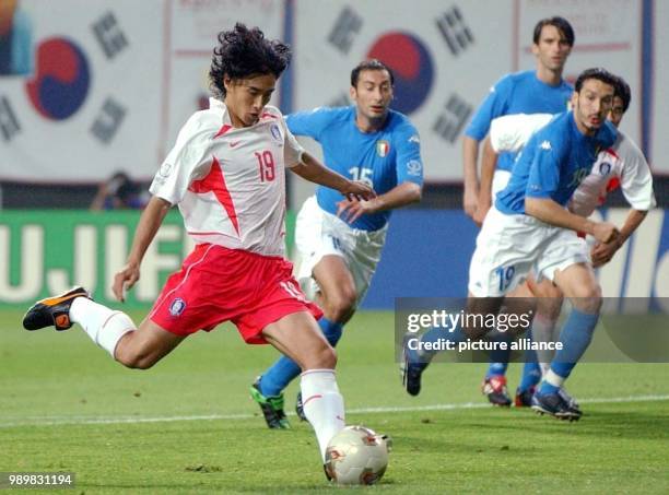 South Korean midfielder Ahn Jung-Hwan is about to kick the ball in full run during the 2002 Soccer World Cup second round game South Korea against...