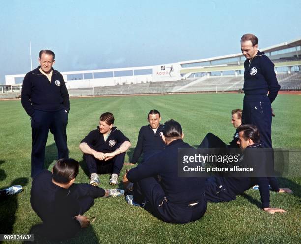 Germany's national team coach Sepp Herberger with players of his team in the stadium in Malmoe, Sweden, during the 1958 Soccer World Cup in Sweden .