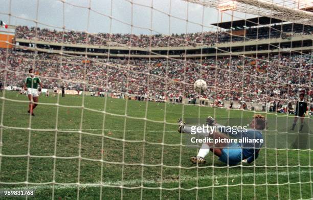 Diving German goalkeeper Toni Schumacher saves with his leg the penalty shot from Mexican Fernando Quirarte. With this save the goalkeeper from...