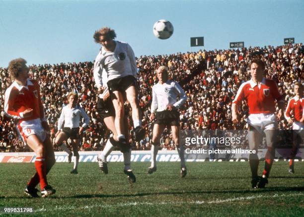 German national team player Bernd Hoelzenbein scores the 2-1 with a header. Germany lost the the 1978 World Cup group A match against Austria by a...