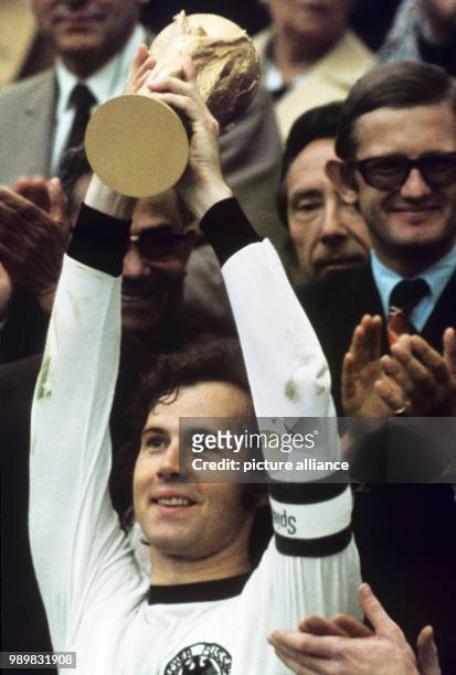 After the victory ceremony team captain Franz Beckenbauer is lifting the trophy up in the air. Germany beat the Netherlands 2:1 in the final match at...