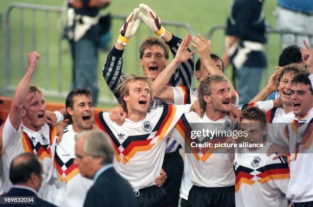 The German national soccer team jubilates and cheers after winning the 1990 World Cup at the Olympic Stadium in Rome, Italy on 08 July 1990. Germany...