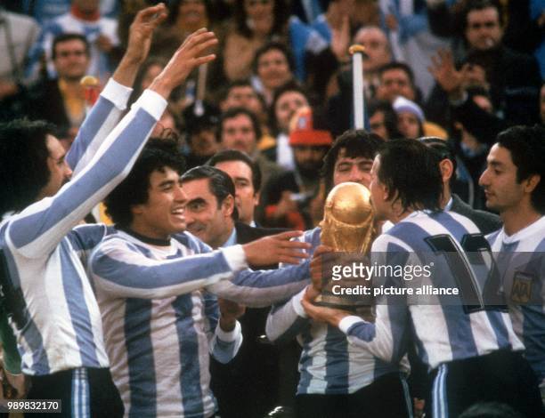 The Argentinean national team breaks out in a joyful celebration after being handed the World Cup. The Argentinean national team wins the World Cup...