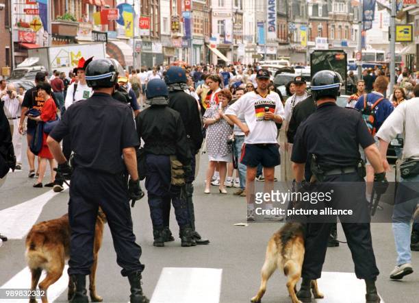 French security forces contain German fans who try to enter the stadium without a ticket for Germany's 1998 World Cup group game against Yugoslavia...