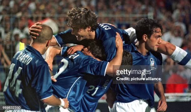 Italian forward Christian Vieri is almost crushed by his jubilant teammates. Vieri has just scored the 2-0 against Cameroon and receives...