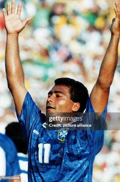 Brazilian forward Romario raises his arms and cheers after scoring the 1-0 goal during the 1994 World Cup semifinal in Pasadena, USA, 13 July 1994.