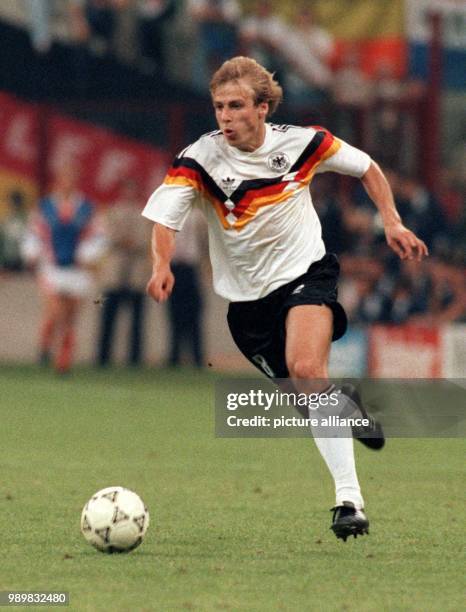 German forward Juergen Klinsmann rushes with the ball towards the Argentinian goal. The German national team wins the World Cup final against...
