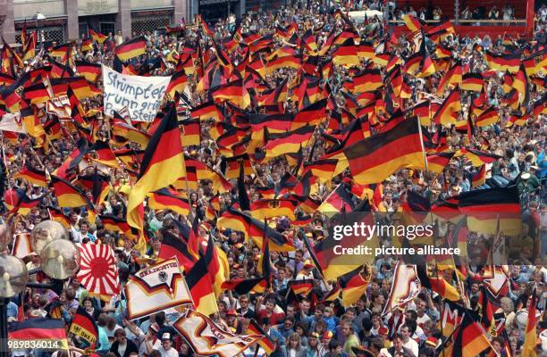 Around 50,000 cheering and flag waving fans and people have gathered on the square in front of the Roemer, town hall, to welcome the German national...