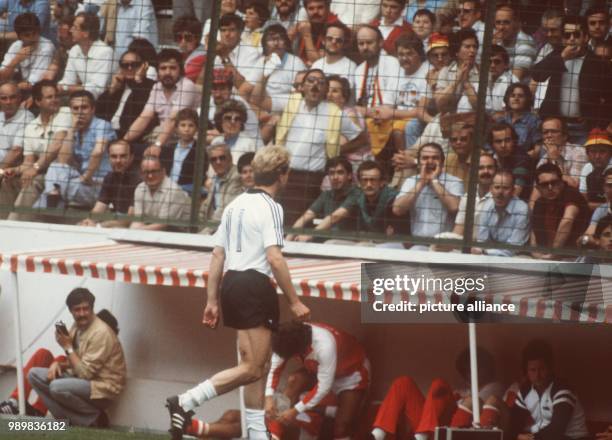 Substituted German forward Karl-Heinz Rummenigge has to accept the angry scolding of the spectators on his way to the bench. The German side takes an...