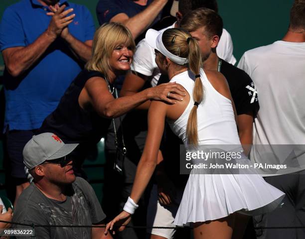 Katie Swan celebrates victory over Irina-Camelia Begu with family members on day one of the Wimbledon Championships at the All England Lawn Tennis...