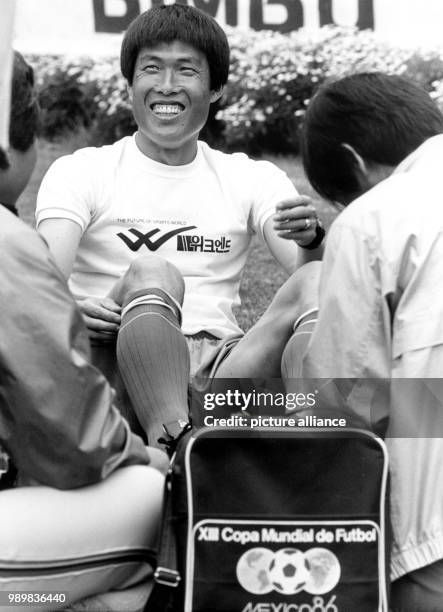 South Korean forward Bum Kun Cha is being treated on his ankle by members of his team's medical staff during a training session during the 1986 World...