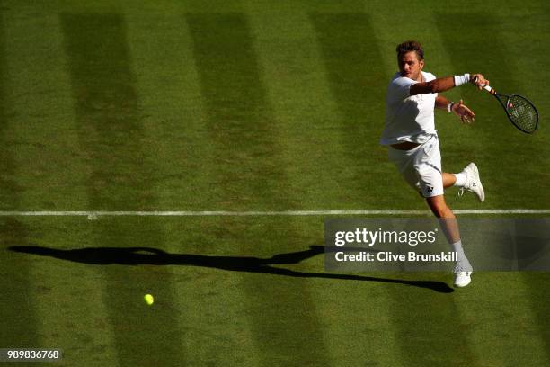 Stanislas Wawrinka of Switzerland returns against Grigor Dimitrov of Bulgaria during their Men's Singles first round match on day one of the...