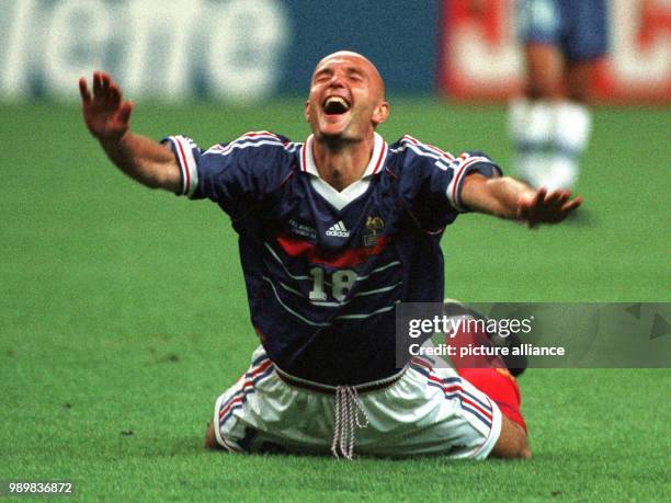 French defender Frank Leboeuf throws himself to the ground and cheers after the 1998 World Cup final Brazil against France in Paris, France, 12 July...