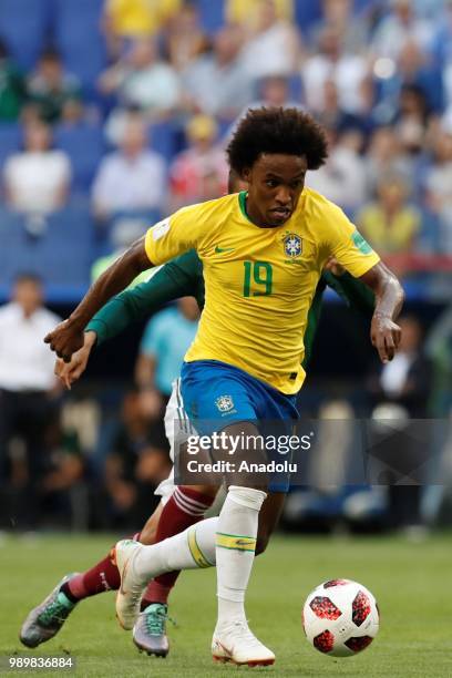 Willian of Brazil in action against player of Mexico during the 2018 FIFA World Cup Russia Round of 16 match between Brazil and Mexico at the Samara...