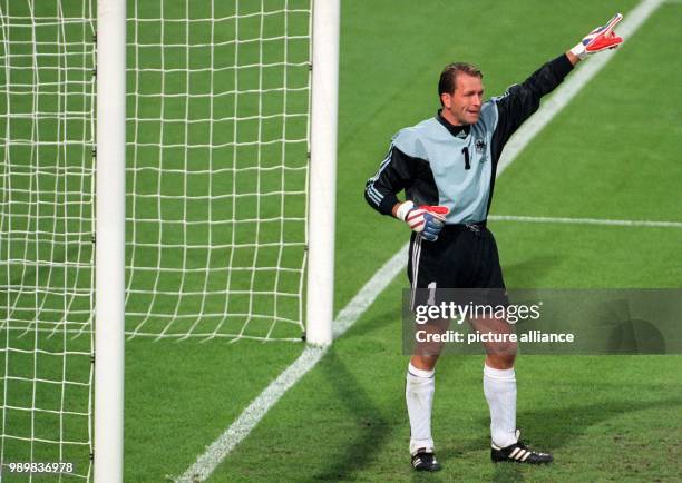 German goalkeeper Andreas Koepke instructs his teammates during the 1998 World Cup quarter final Germany against Croatia at the Gerland stadium in...