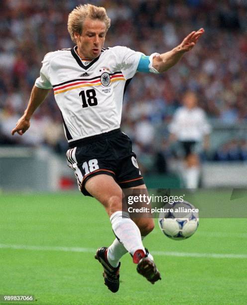 German forward and team captain Juergen Klinsmann is about to kick the ball torwards the Croatian goal during the 1998 World Cup quarter final...