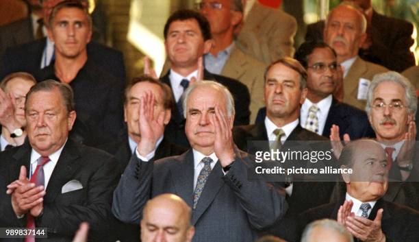 German Chancellor Helmut Kohl sits next to Lennart Johansson, President of the European Soccer Association and Joseph Blatter, President of the...