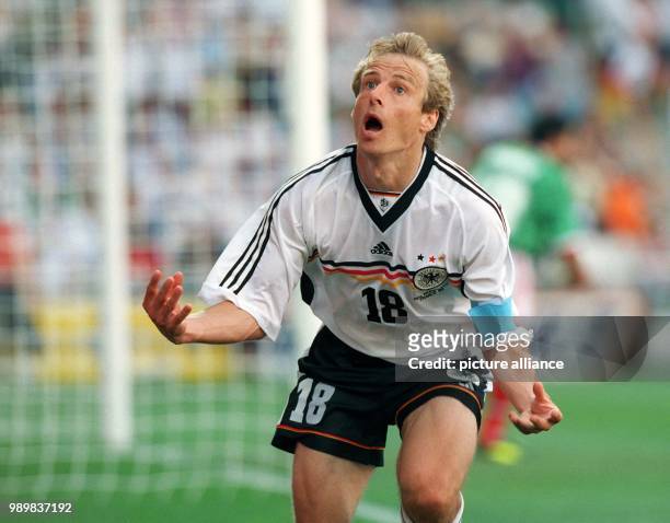 German forward Juergen Klinsmann cheers after scoring the 1-1 goal during the 1998 World Cup round of 16 game Germany against Mexico at the stadium...