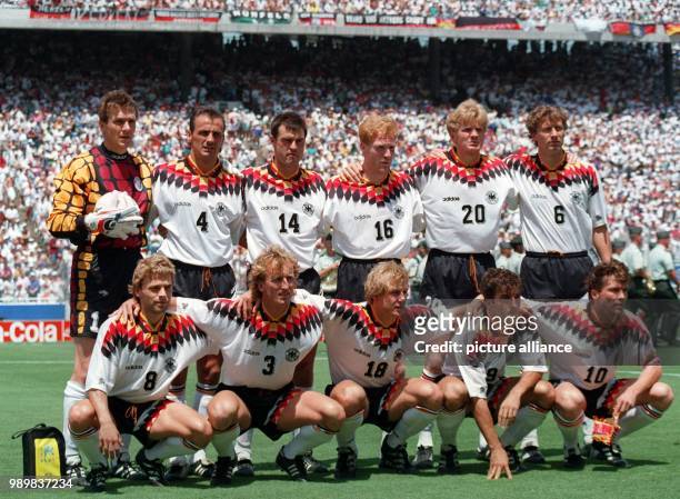 The players of the German national soccer team pose for a group picture on the pitch before the start of the 1994 World Cup soccer game German...