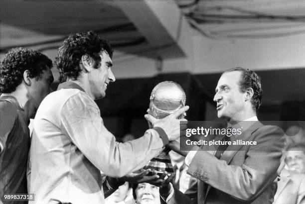 Italian captain and goalkeeper Dino Zoff is handed the World Cup trophy from Spanish king Juan Carlos . Italy wins the final of the World Cup against...