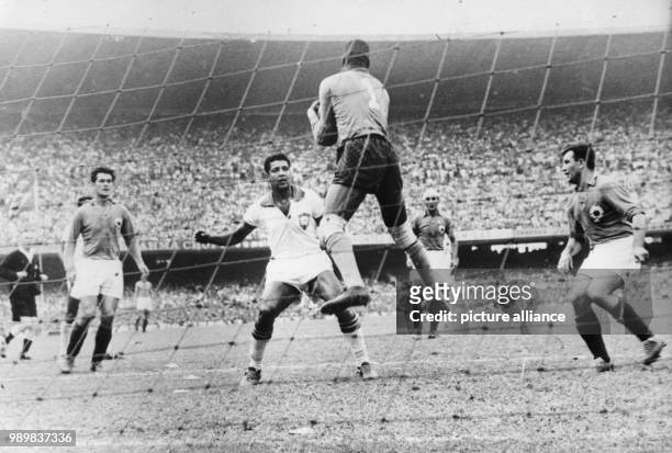 In front of an audience of 142,000 at Rio de Janeiro's Maracana Stadium host Brazil and Yugoslavia play a preliminary round game of the IV. Soccer...