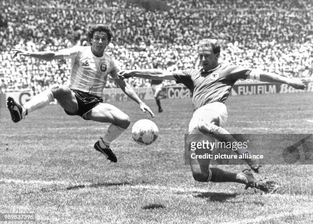 Argentinean Ruggieri fails to break up the pass as German forward Karl-Heinz Rummenigge shoots a volley kick that misses the goal. The Argentinean...