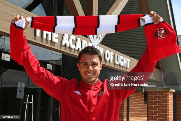 New signing Rees James holds a Sunderland scarf at The Academy of Light on July 2, 2018 in Sunderland, England.
