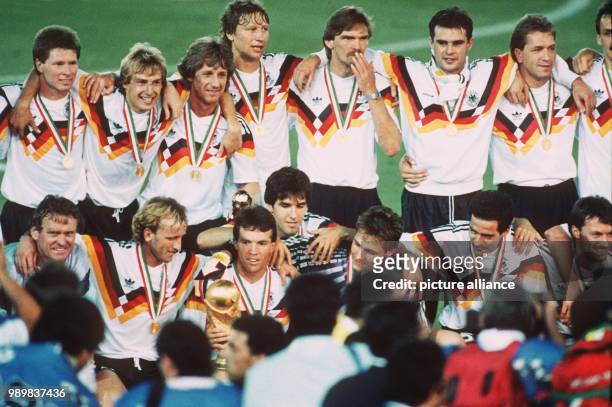 The German team assembles for a team photo after the presentation ceremony of the 1990 World Cup: Stefan Reuter, Juergen Klinsmann, Frank Mill, Guido...