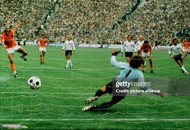 German goalkeeper Sepp Maier dives into the wrong corner. The first goal was scored on a penalty by Dutch player Johan Neeskens during the 1974 World...