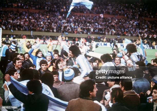 The exultant Argentine World Champions are lifted upon the shoulders of a zesty crowd at River Plate Stadium in Buenos Aires, Argentinaon 25 June...