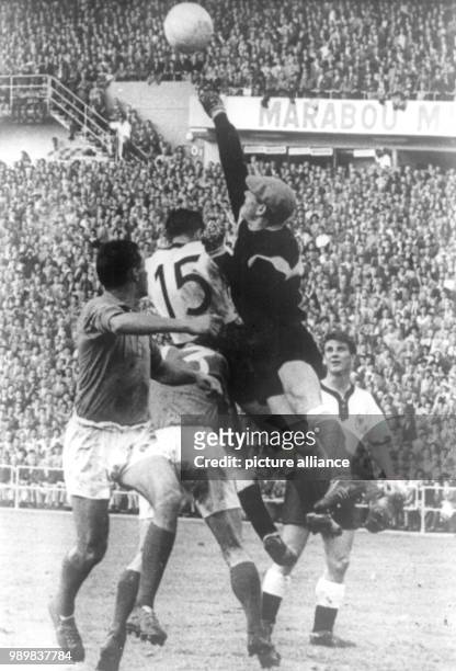 Danger in front of the French goal: French goalkeeper Abbes punches the cross ball into the field before German forward Alfred Kelbassa is able to...