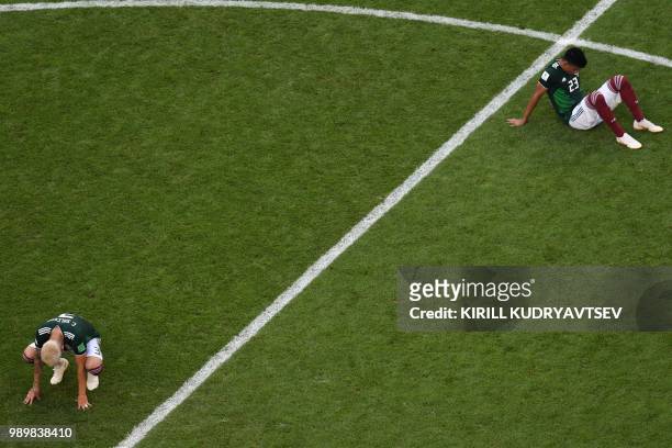 Mexico's defender Jesus Gallardo and Mexico's defender Carlos Salcedo react to their defeat at the end of the Russia 2018 World Cup round of 16...