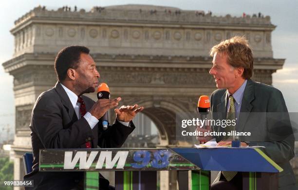 Brazil's football hero Pele was chatting with ZDF host Wolf-Dieter Poschmann about the opening ceremony and the so far played matches during the 1998...
