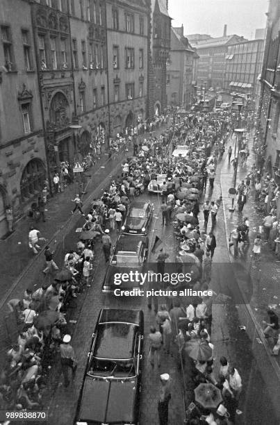 Arrival in a motorcade on June 23rd at the Roemer. Although it was raining heavily thousands came to greet and celebrate the German national football...