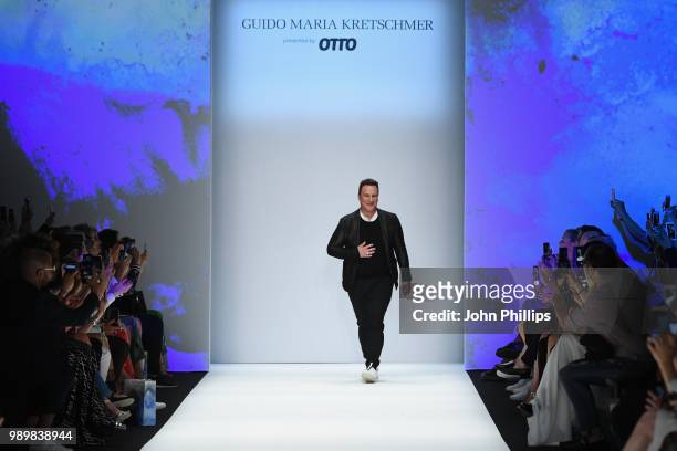 Designer Guido Maria Kretschmer acknowledges the applause of the audience after his show during the Berlin Fashion Week Spring/Summer 2019 at ewerk...