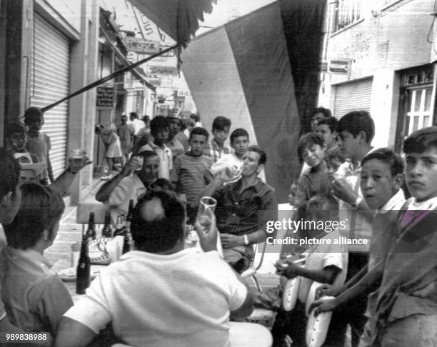 After Germany's national football team won 3:2 against England at the 1970 FIFA World Cup in June in Mexico, German fans are celebrating in a street...