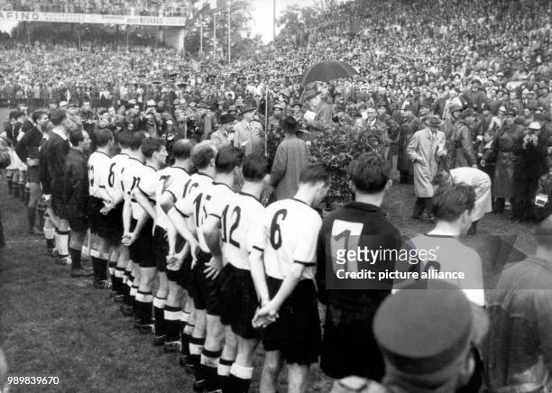 After beating Hungary 3:2 in the 1954 FIFA Word Cup final at Bern's Wankdorf stadium in front of 60.000 spectators on July 4th, Germany lines up for...